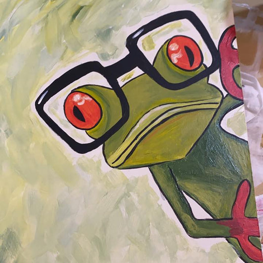 Colorful drawing of a frog with glasses on a textured green background